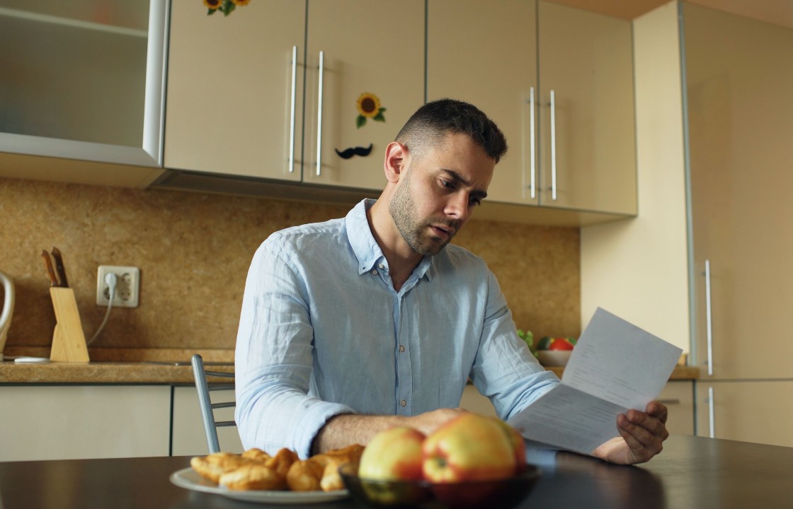 Person reviewing an HMRC Simple Assessment letter at home