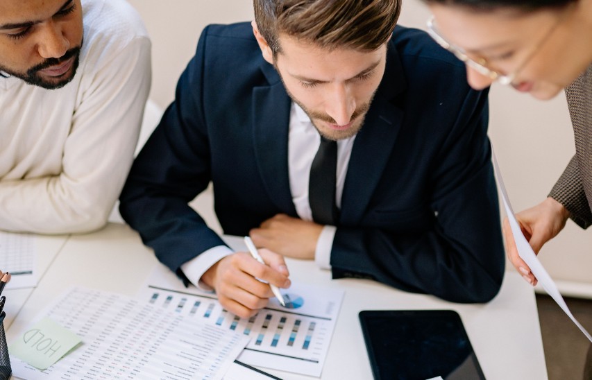 Business team reviewing financial charts and data together